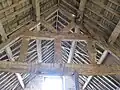 Roof truss in hay barn-reused from an earlier building