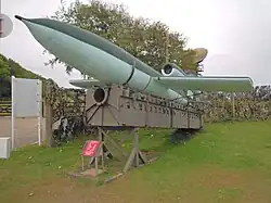 A replica V1 Flying Bomb, mounted on an original section of a launching ramp