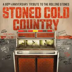 A rendition of a jukebox with the names of all the participating artists written on the wall to its sides, and the album name above it in large block letters.