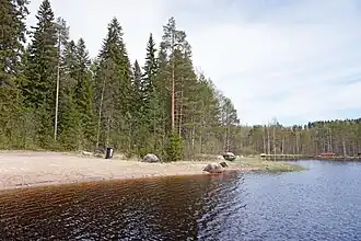 A beach by the lake Vesankajärvi.