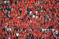 Supporters of the Vietnam national football team wearing attire that is visually inspired by the National Flag in the 2019 AFC Asian Cup