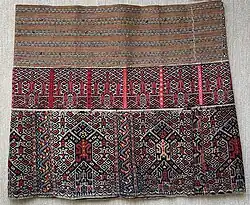 Vintage skirt with human figures woven by the Run Li people of Hainan, courtesy the Wovensouls collection