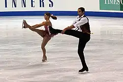 Side by side spins Tiffany Vise and Derek Trent