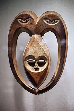 Kwele mask; 19th–20th century; wood coloured with kaolin; from Gabon or Democratic Republic of Congo; height: 52.7&nbsp;cm (203⁄4 in.), width: 38.1&nbsp;cm (15 in.); depth: 10.2&nbsp;cm (4 in.); Metropolitan Museum of Art. This mask was used in the rituals of witchcraft protection