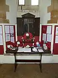 The First World War Roll of Honour inside the porch.
