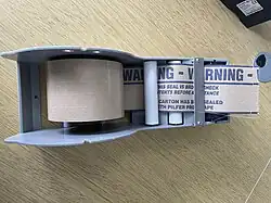 Water-activated tape in a tape dispenser