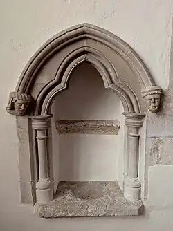 The piscina at St. Andrews church, West Stoke, West Sussex, England. May 2025.