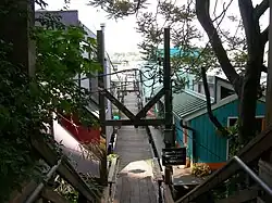 Looking along a dock in Westlake, with floating homes on either side.