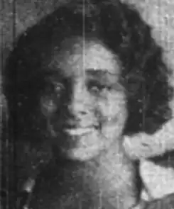 Wezlynn Tildon, from a 1934 newspaper photo; a smiling Black teenaged girl, wearing a dress with a large white bow on the front