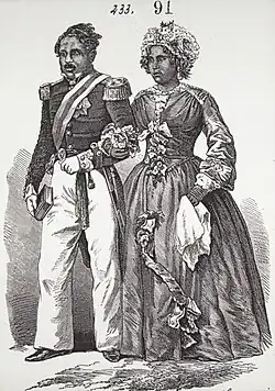 Engraving of Malagasy couple in 19th-century elegant European dress, walking arm in arm