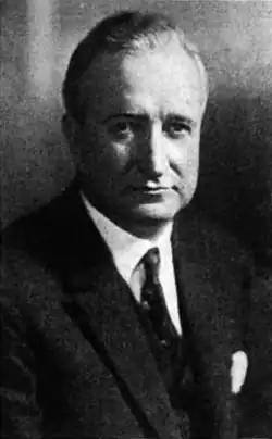 The upper body of a man in a suit