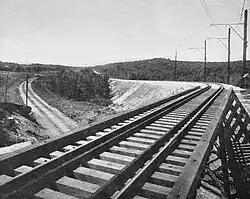A streetcar trestle crossing over a railway line