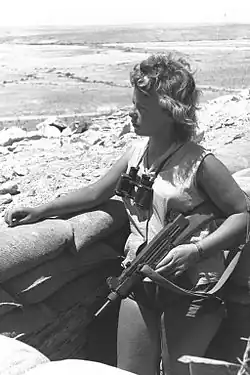 An Uzi-armed Israeli on guard duty in the Negev (1956), note wooden stock