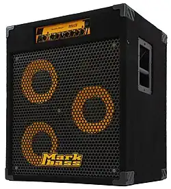 A portable bass amplifier/speaker cabinet is shown. This Markbass brand unit has three ten-inch loudspeakers.