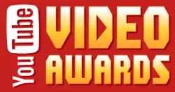 The words "YouTube VIDEO AWARDS" written against a red background. "YouTube" is written vertically against the left-hand side of the image. "You" is written in a white font"; "Tube" is written in a red font within a white, rounded rectangle. "VIDEO AWARDS" is written in a yellow-white font. The middle of the D in "VIDEO" is a right-pointing triangle, like a "Play" logo.