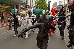 A group (or zinnode) in insect-inspired costumes