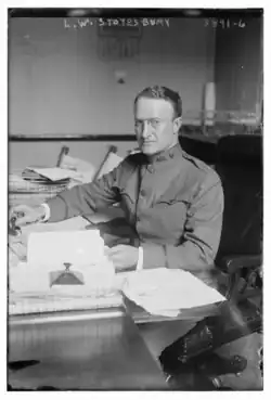 1915 black and white photo of Brigadier general Louis W. Stotesbury in dress uniform, seated at desk