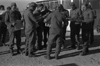 UNEF soldiers reading newspapers